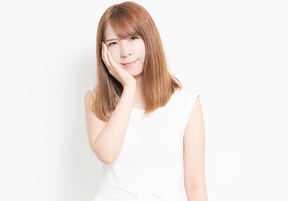 頬が痛い女性